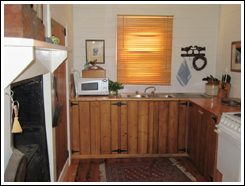 Fully equipped kitchen with microwave and electric stove